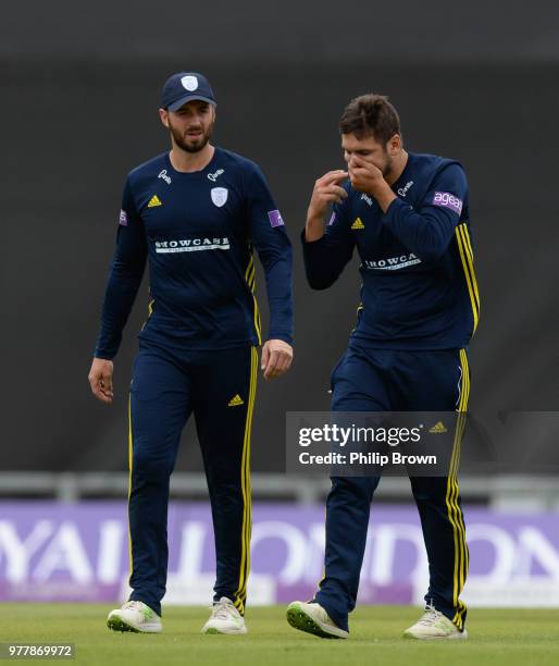 Rilee Rossouw of Hampshire leaves the field injured watched by James Vince during the Royal London One-Day Cup Semi-Final match between Hampshire and...