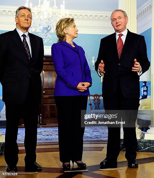 Secretary of State Hillary Clinton speaks to reporters with Northern Ireland First Minister Peter Robinson and Deputy First Minister Martin...