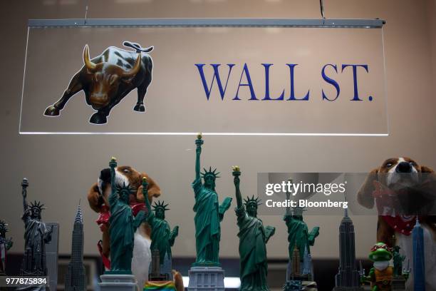 Souvenirs stand on display for sale at a shop near the New York Stock Exchange in New York, U.S., on Monday, June 18, 2018. U.S. Stocks shook off the...