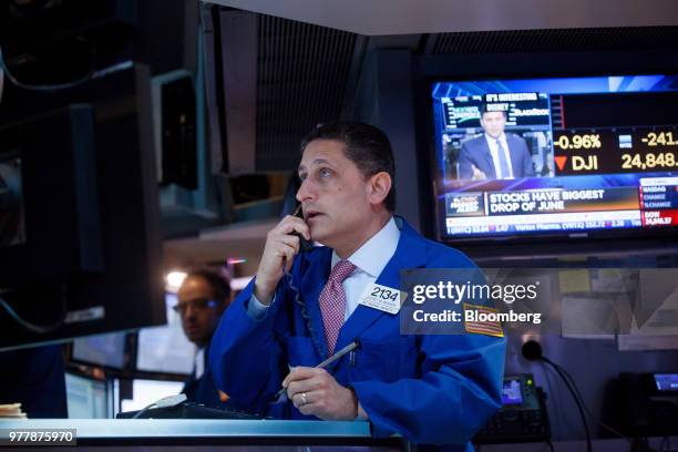 Trader works on the floor of the New York Stock Exchange in New York, U.S., on Monday, June 18, 2018. U.S. Stocks shook off the worst of their losses...