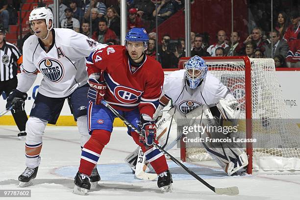 Tomas Plekanec of Montreal Canadiens waits for a pass with Jason Strudwick of Edmonton Oilers during the NHL game on March 11, 2009 at the Bell...