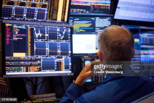 Trader works on the floor of the New York Stock Exchange in New York, U.S., on Monday, June 18, 2018. U.S. Stocks shook off the worst of their losses...