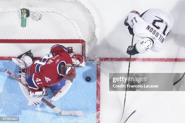 Jaroslav Halak of Montreal Canadiens blocks a shot of Robert Nilsson of Edmonton Oilers during the NHL game on March 11, 2009 at the Bell Center in...