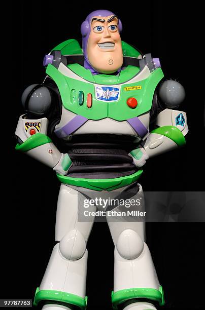 Buzz Lightyear character appears onstage to introduce a screening of the film, "Toy Story 3" at the Paris Las Vegas during ShoWest, the official...
