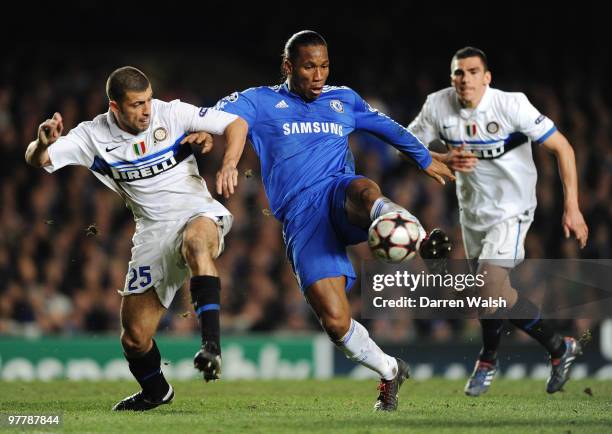 Didier Drogba of Chelsea is challenged by Walter Samuel of Inter Milan during the UEFA Champions League round of 16 second leg match between Chelsea...