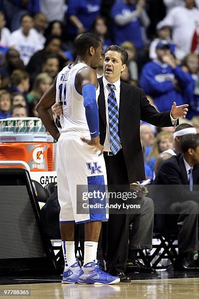 Head coach John Calipari of the Kentucky Wildcats talks with John Wall against the Mississippi State Bulldogs during the final of the SEC Men's...