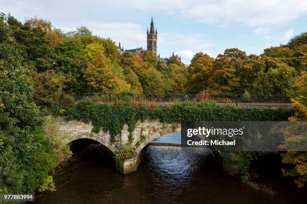 university of glasgow behind lush trees, glasgow, scotland, uk - glasgow scotland stock pictures, royalty-free photos & images