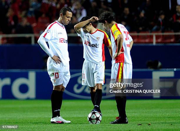 Sevilla's Brazilian forward Luis Fabiano , Brazilian midfielder Renato and Argentinian midfielder Diego Perotti react after CSKA Moscow scored during...