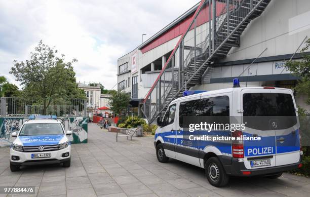 June 2018, Germany, Frankfurt : Police vehicles parked at the edge of a square before a shopping centre in downtown Frankfurt . Here was the site of...