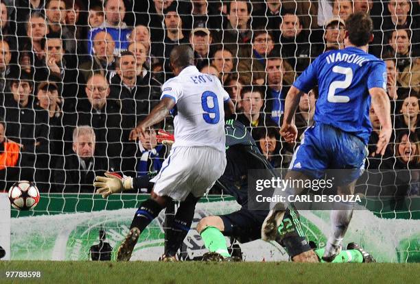 Inter Milan's Cameroonian forward Samuel Eto'o scores past Chelsea's goalkeeper Ross Turnbull as Chelsea's defender Branislav Ivanovic looks on...