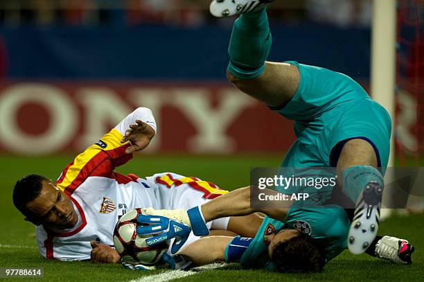 Sevilla's Brazilian forward Luis Fabiano vies with CSKA Moscow' s Rusian goalkeeper Igor Akinfeev during their UEFA Champions League football match...