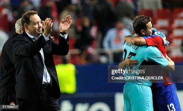 Moscow's coach Leonid Slutsky, Russian goalkeeper and captain Igor Akinfeev and Chilean midfielder Mark Gonzalez celebrate after winning a UEFA...