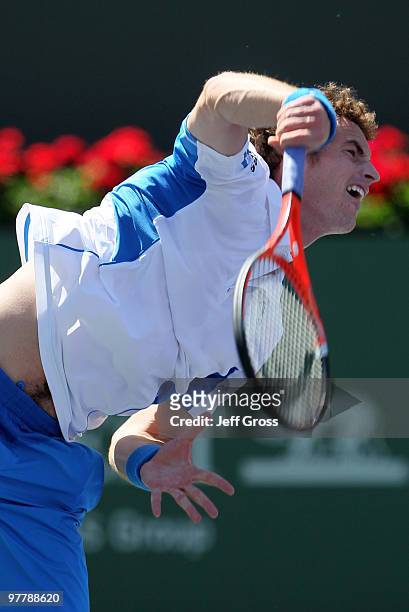 Andy Murray of Great Britain hits a serve against Michael Russell during the BNP Paribas Open at the Indian Wells Tennis Garden on March 16, 2010 in...