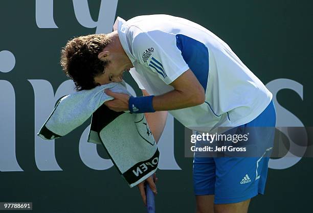 Andy Murray of Great Britain wipes his brow during play against Michael Russell at the BNP Paribas Open at the Indian Wells Tennis Garden on March...