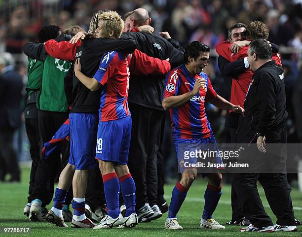 Keisuke Honda of CSKA Moscow celebrates with his teammates at the end of the UEFA Champions League round of sixteen second leg match between Sevilla...
