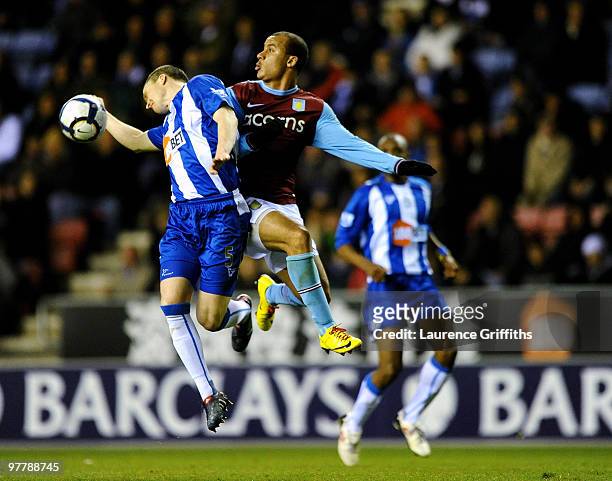 Gabriel Agbonlahor of Aston Villa battles with Gary Caldwell of Wigan during the Barclays Premier League match between Wigan Athletic and Aston Villa...