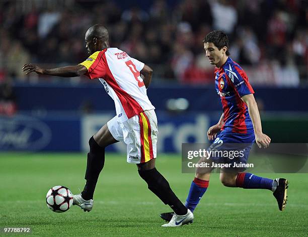 Didier Zokora of Sevilla shields Evgeni Aldonin of CSKA Moscow from the ball during the UEFA Champions League round of sixteen second leg match...