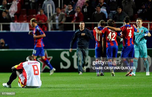 Sevilla's midfielder from Ivory Coast Didier Zokora reacts after loosing a UEFA Champions League football match against CSKA Moscow on March 16, 2010...