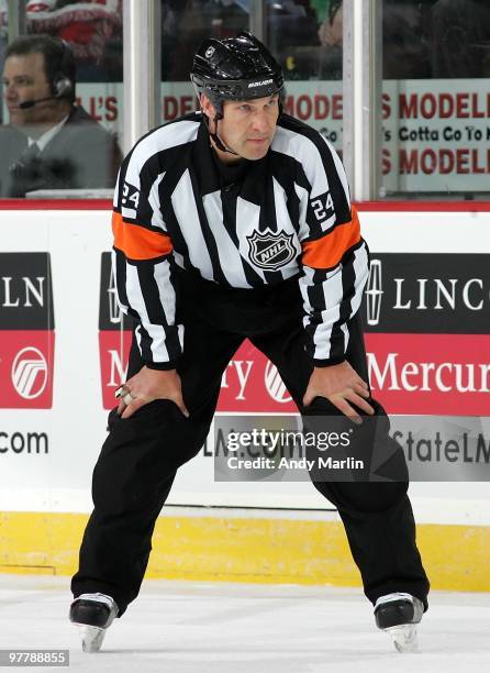 Referee Stephen Walkom positions himself during a faceoff during the game between the Boston Bruins and the New Jersey Devils at the Prudential...