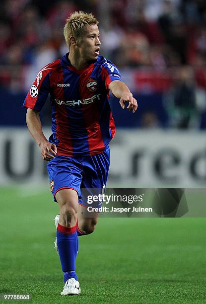 Keisuke Honda of CSKA Moscow directs a teammate during the UEFA Champions League round of sixteen second leg match between Sevilla and CSKA Moscow at...