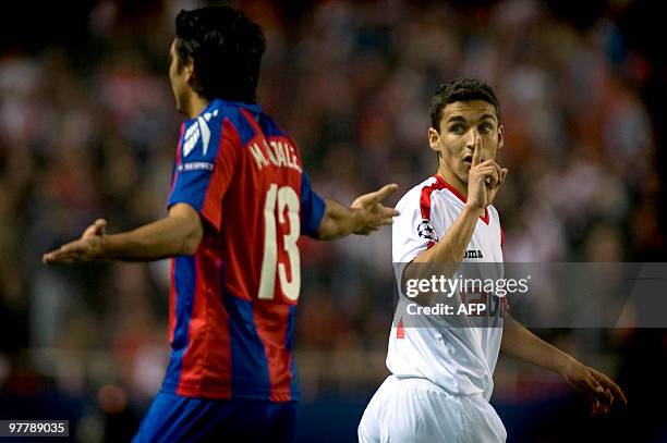 Sevilla's midfielder Jesus Navas gestures next to CSKA Moscow's Chilean midfielder Mark Gonzalez during their UEFA Champions League football match on...