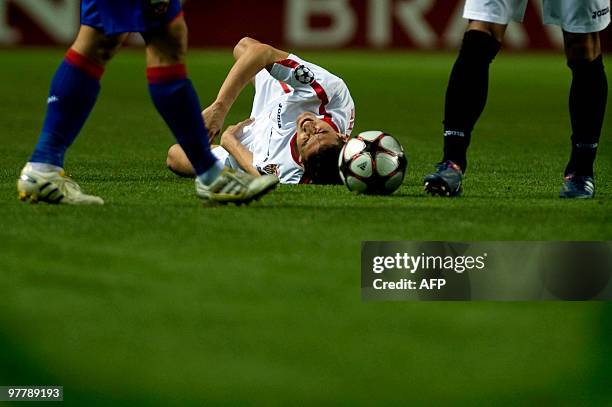 Sevilla's midfielder Jesus Navas gestures in pain during a UEFA Champions League football match against CSKA Moscow on March 16, 2010 at Ramon...