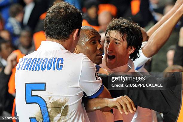 Inter Milan's Cameroonian forward Samuel Eto'o celebrates after scoring with Inter Milan's Argentinian forward Alberto Milito Diego and Inter Milan's...