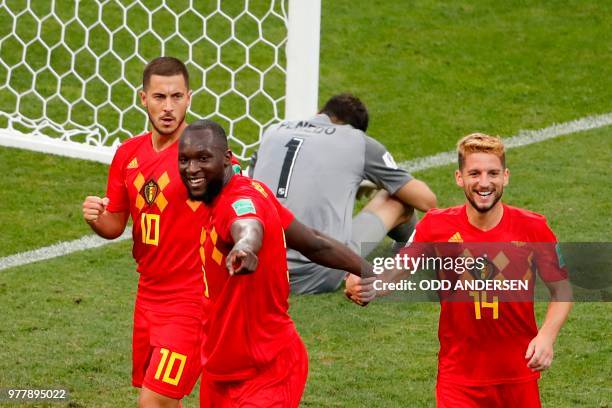 Belgium's forward Romelu Lukaku celebrates his first goal, his team's second, with Belgium's forward Dries Mertens and Belgium's forward Eden Hazard...