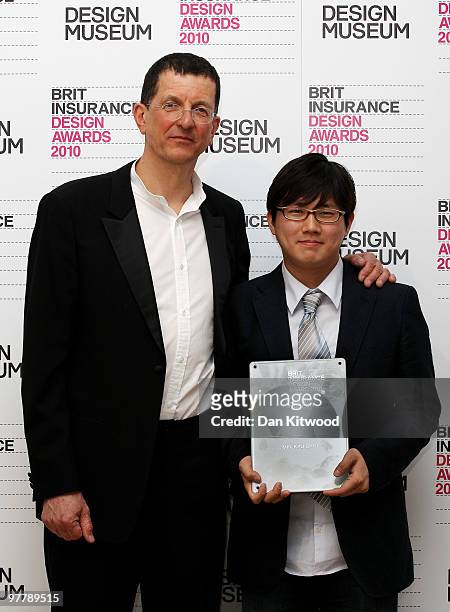 Min-Kyu Choi accepts the Brit Insurance Design of the Year Award from jury chair Antony Gormley, at the Design Museum on March 16, 2010 in London,...