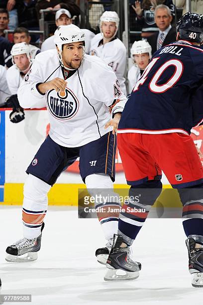 Defenseman Theo Peckham of the Edmonton Oilers prepares to fight forward Jared Boll of the Columbus Blue Jackets on March 15, 2010 at Nationwide...