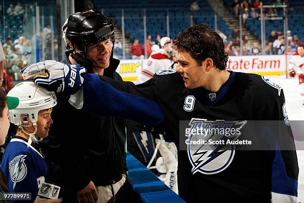 Steve Downie of the Tampa Bay Lightning greets fans during pre-game skate against the Phoenix Coyotes at the St. Pete Times Forum on March 16, 2010...