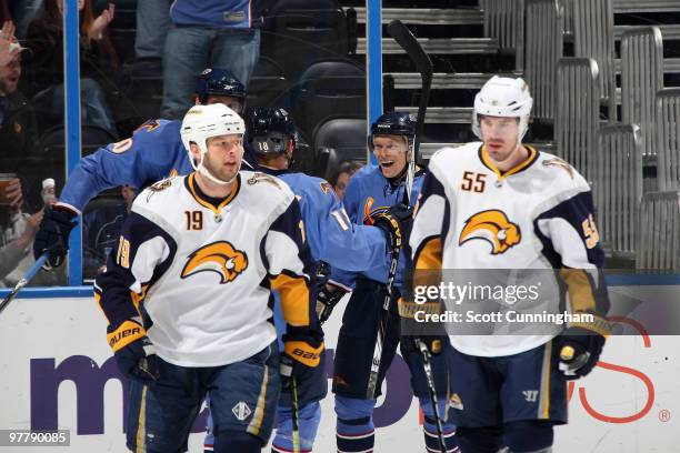 Maxin Afinogenov of the Atlanta Thrashers is congratulated by teammates after scoring a first period goal as Tim Connolly and Jochen Hecht of the...