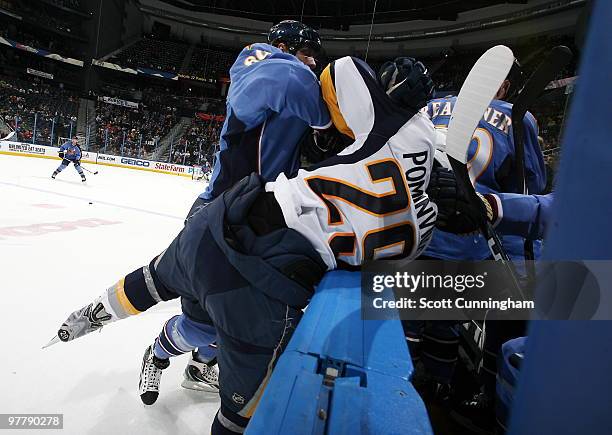 Jason Pominville of the Buffalo Sabres is checked by Nik Antropov of the Atlanta Thrashers at Philips Arena on March 16, 2010 in Atlanta, Georgia.