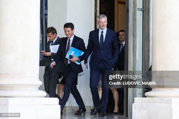 French Government's Spokesperson Benjamin Griveaux and French Economy Minister Bruno Le Maire leave following the weekly Cabinet meeting on June 18,...