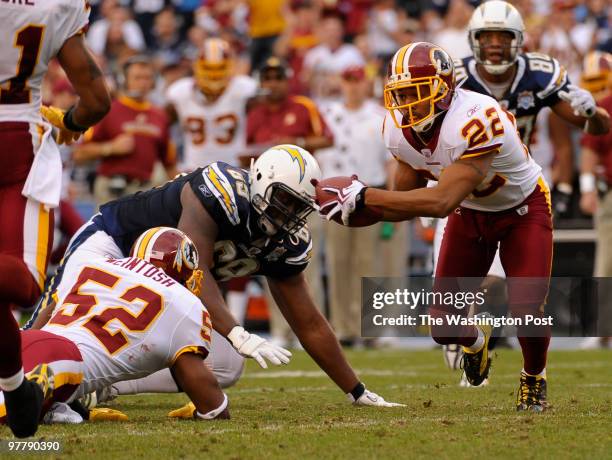 Washington Redskins Carlos Rogers scoops up a fumble by Rocky Mcintosh who caught an interception in the third quarter of San Diego's 23-20 win on...