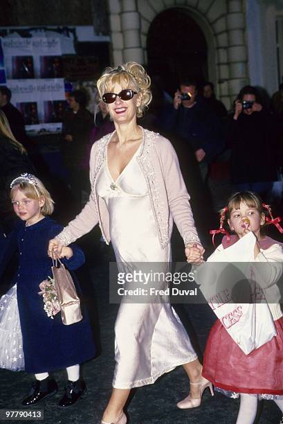 Paula Yate, whilst pregnant with daughter Heavenly Hiraani Tiger Lily Hutchence, walks with one of her three daughters with Bob Geldof, Pixie Geldof