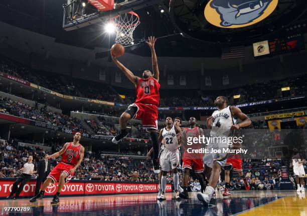Acie Law of the Chicago Bulls shoots against Rudy Gay and Sam Young of the Memphis Grizzlies on March 16, 2010 at FedExForum in Memphis, Tennessee....