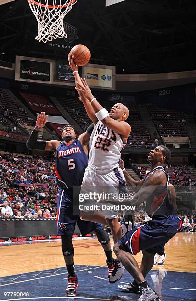 Jarvis Hayes of the New Jersey Nets shoots the basketball against Josh Smith of the Atlanta Hawks during the game on March 16, 2010 at the Izod...