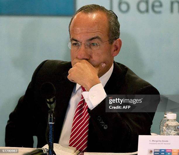 Mexican President Felipe Calderon gestures during a meeting with local and state authorities in Ciudad Juarez, Chihuahua state, Mexico on March 16,...