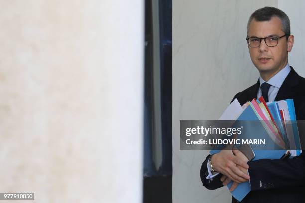 The French president's chief of staff, Alexis Kohler walks through the hallway of the Elysee palace following the weekly Cabinet meeting on June 18,...