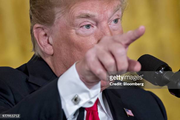 President Donald Trump gestures while speaking during a National Space Council meeting in the East Room of the White House in Washington, D.C., on...