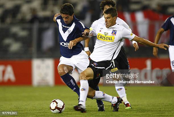 Argentina's Velez Sarfield Leandro Somoza vies for the ball with Andres Scotti of Colo Colo during their 2010 Libertadores Cup soccer match on March...