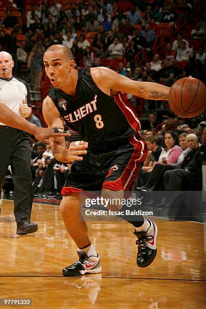 Carlos Arroyo of the Miami Heat drives against the San Antonio Spurs on March 16, 2010 at American Airlines Arena in Miami, Florida. NOTE TO USER:...