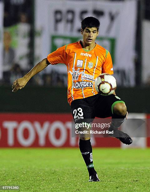 Emmanuel Pio of Argentina's Banfield kicks the ball during their 2010 Libertadores soccer match against Nacional at Florencio Sola stadium on March...