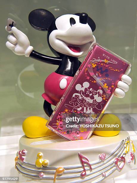 Japanese Sony digital audio player "Walkman S-series", engraved with designs of Disney characters Mickey and Minnie Mouse, sits on display at the...
