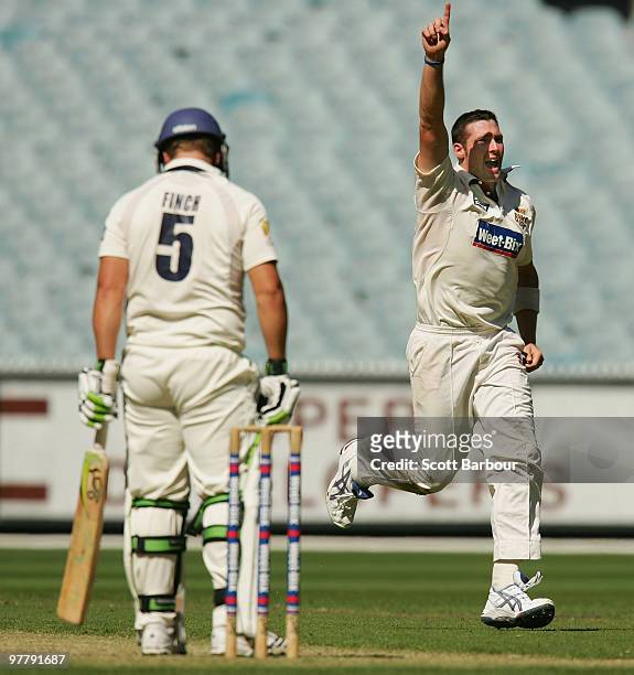 Luke Feldman of the Bulls celebrates after dismissing Aaron Finch of the Bushrangers during day one of the Sheffield Shield Final between the...