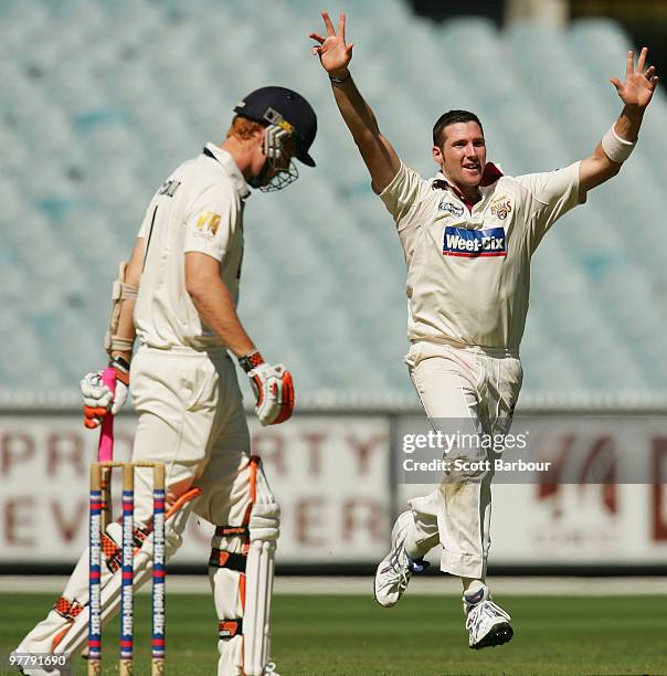 Luke Feldman of the Bulls celebrates after dismissing Andrew McDonald of the Bushrangers during day one of the Sheffield Shield Final between the...