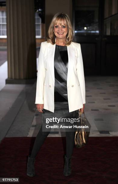 Model Twiggy arrives at a reception for the British Clothing Industry at Buckingham Palace on March 16, 2010 in London, England