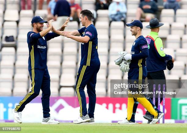 Hampshire bowler Chris Wood celebrates taking the winning wicket of Yorkshire's Ben Coad with Gareth Berg and Lewis McManus during the Royal London...