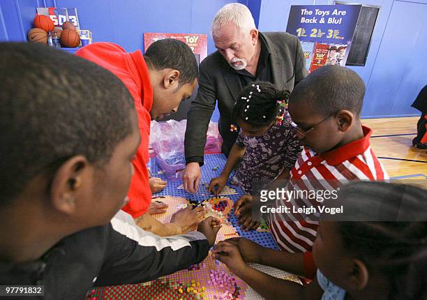 John Ratzenberger helps build a "Toy Story" LEGO mural to benefit the Boys & Girls Club of America on March 16, 2010 in Alexandria, Virginia.